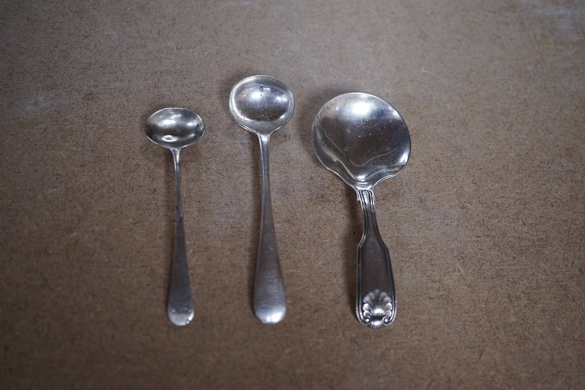 Sundry small silver including a pair of Edwardian silver drum mustards, London, 1907/8, 73mm, a Georgian pepperette, an Emes & Barnard pepperette, a Liberty & Co mustard pot, two other pepperettes and seven other items.